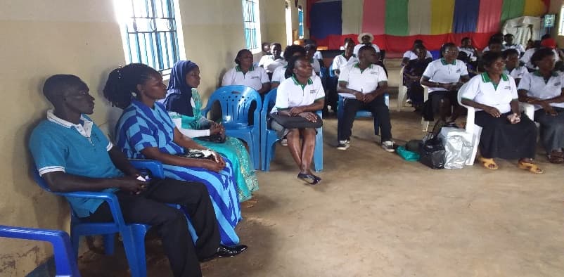 Group members wearing their group uniforms at a meeting